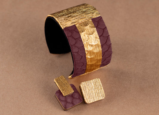 La Manchette ELENA en cuir marin et crépon doré